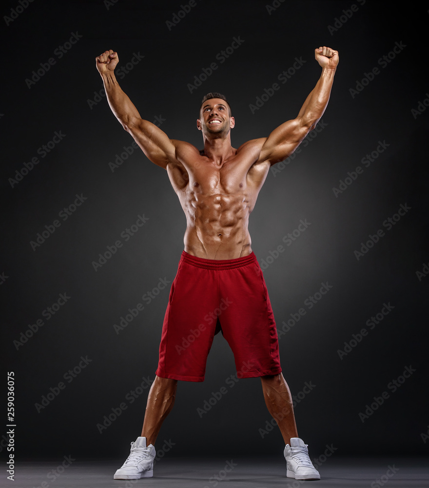 Handsome Body Builder Flexing Muscles