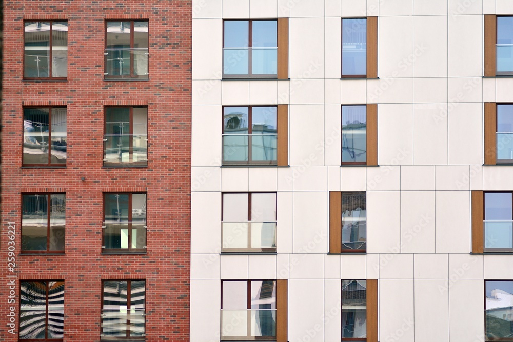 Fototapeta premium Fragment of a modern apartment building in front. Very modern apartment house.