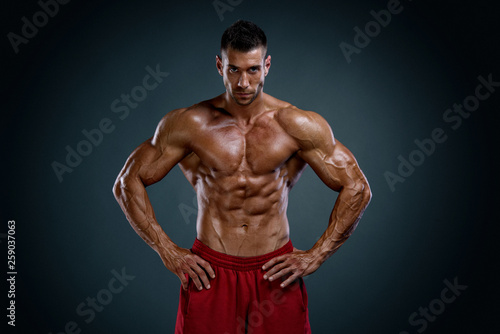 Handsome Body Builder Flexing Muscles © mrbigphoto