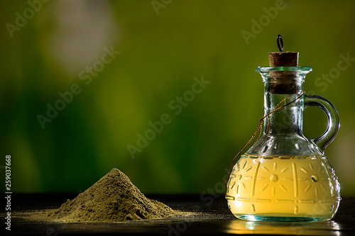  Te moringa powder and oil in glass container
