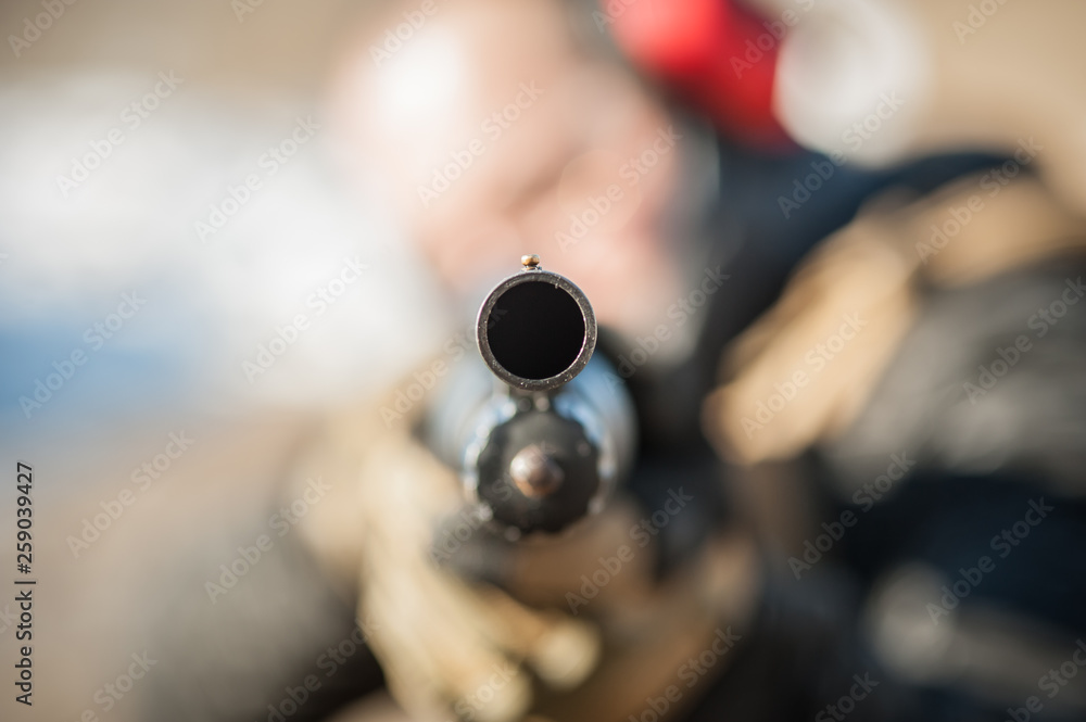 Direct macro detail close-up shotgun weapon front view gun point Direct macro detail close-up shotgun weapon front view gun point