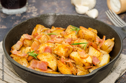 Tyrolean fried potatoes with bacon and onion in a pan. Tyrolean potato specialty