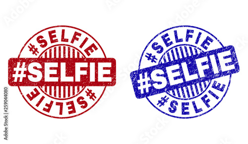 Grunge #SELFIE round stamp seals isolated on a white background. Round seals with grunge texture in red and blue colors. Vector rubber imprint of #SELFIE title inside circle form with stripes.