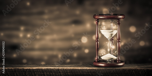 Vintage Hourglass On Wooden Table With Bokeh Background And Sepia Effect - Time Concept © Philip Steury