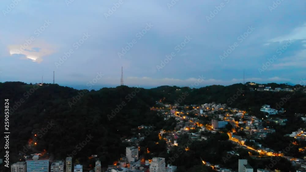 Front aerial night view of the house lights in Mountains - Dolly back Front aerial night view of the house lights in Mountains - Dolly back