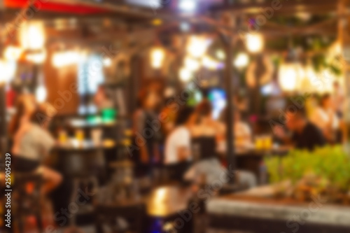 abstract blur image of night festival in a restaurant and The atmosphere is happy and relaxing with bokeh for background