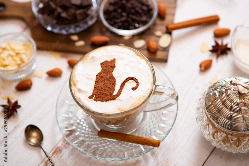 cat mark decorated on cup of hot chocolate cat mark decorated on cup of hot chocolate