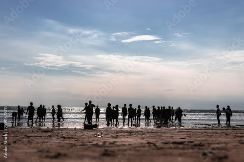 Beach in Kuta Bali with people on the background
