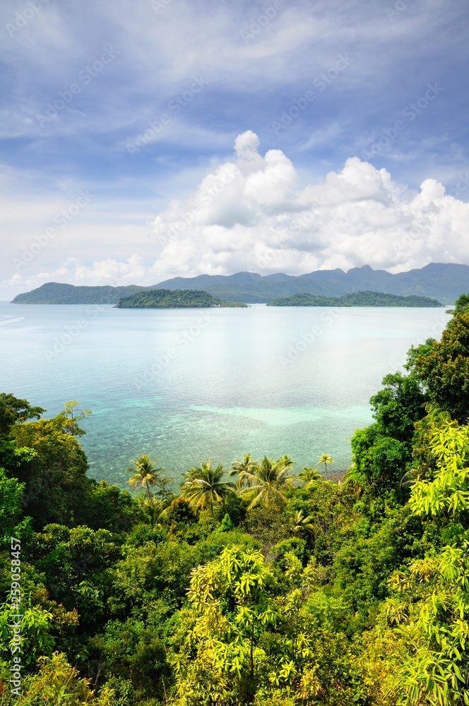 Aerial view on the tropical island, turquoise sea, mountains, blue sky and scenic clouds at the Koh Chang island, Thailand.