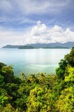 Aerial view on the tropical island, turquoise sea, mountains, blue sky and scenic clouds at the Koh Chang island, Thailand.