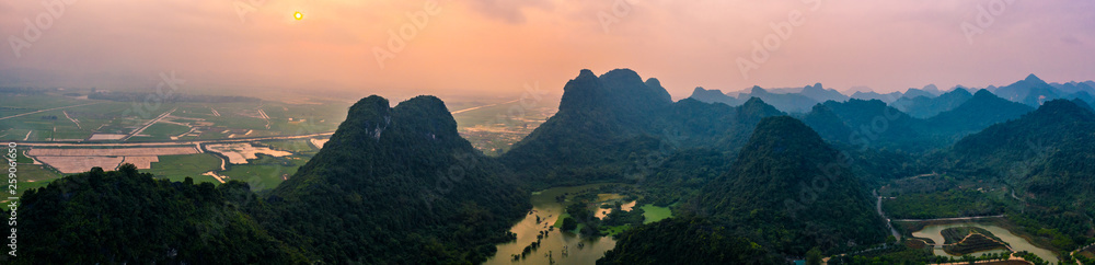Aerial drone photo - Mountains and lakes of northern Vietnam at sunset.  