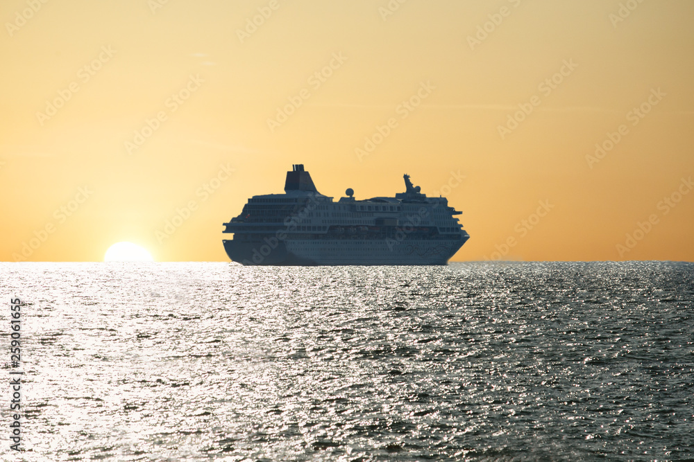 Luxury cruise ship leaving port at sunset, Travel concept. Luxury cruise ship leaving port at sunset, Travel concept.