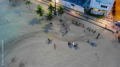 Top night view of brazilians taking their food stalls back from the beach