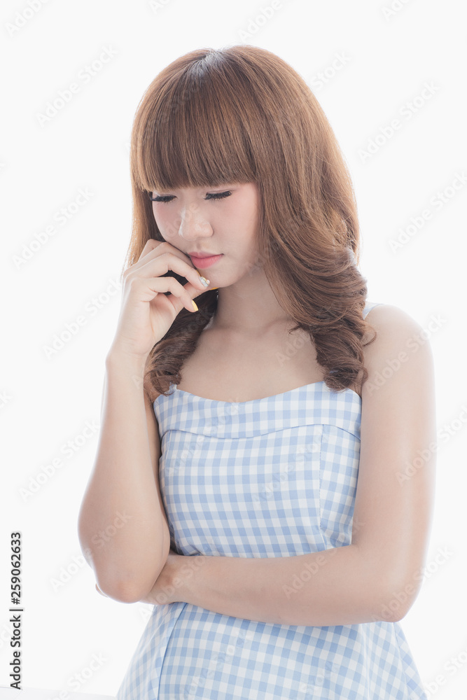 Front view close-up portrait of young beautiful Asian woman with curly long dark brown hair in light blue checked dress stand up straight isolated white background Front view close-up portrait of young beautiful Asian woman with curly long dark brown hair in light blue checked dress stand up straight isolated white background