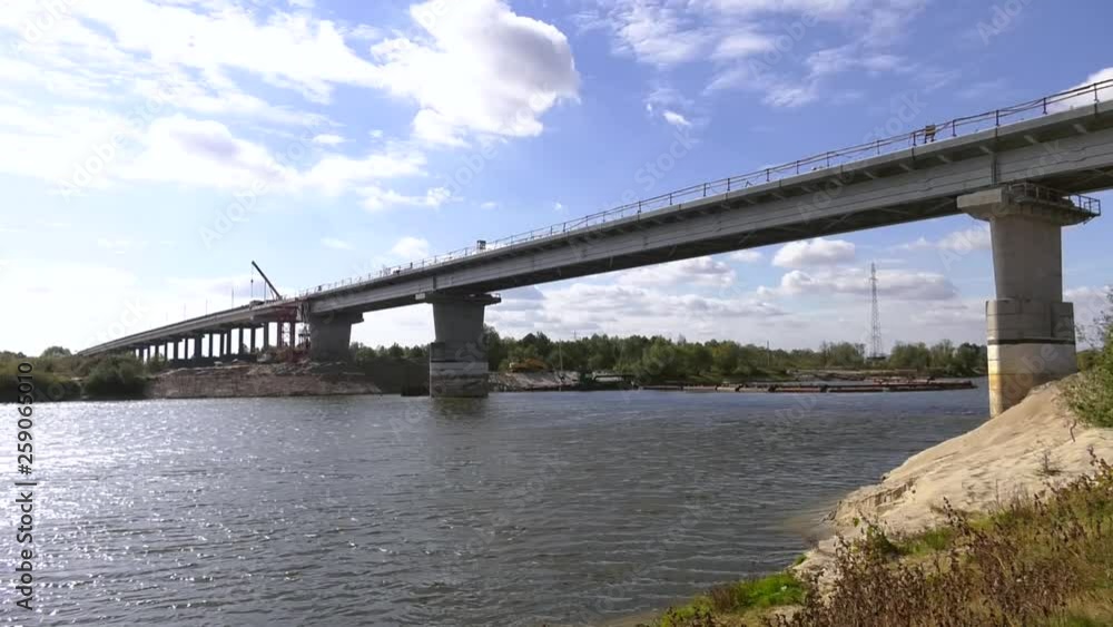 Construction of a concrete bridge. Construction of an automobile bridge at a construction site. process of bridge construction to pass through it motorways Construction of a concrete bridge. Construction of an automobile bridge at a construction site. process of bridge construction to pass through it motorways
