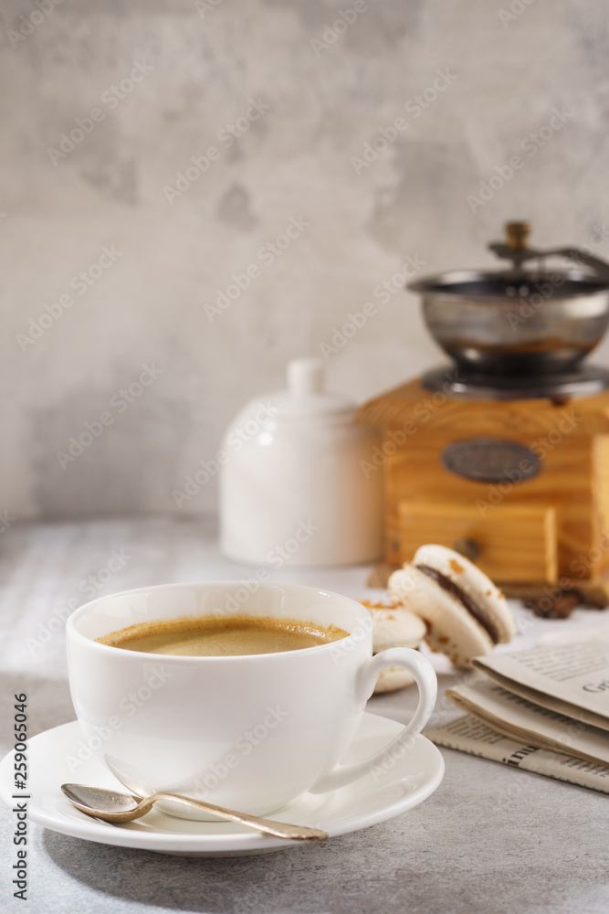 Black coffee and french macarons. Sunny morning breakfast. Black coffee and french macarons. Sunny morning breakfast.