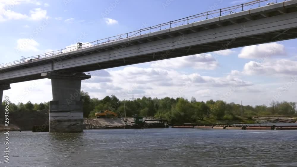Repair of the automobile bridge across the river. Construction of a concrete bridge. Construction of an automobile bridge at a construction site. Repair of the automobile bridge across the river. Construction of a concrete bridge. Construction of an automobile bridge at a construction site.