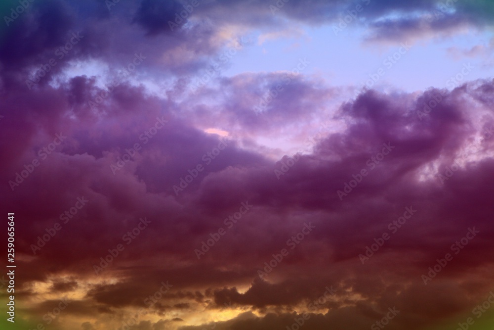 wonderful toned sun colored clouds on the sky for using in design as background.