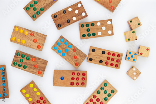 Wooden domino pieces on white background