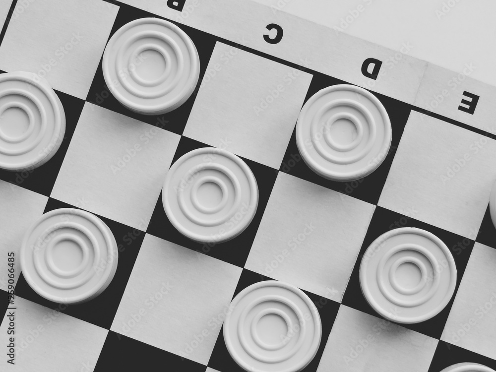 Checkerboard with checkers. Business strategy competition, strategic