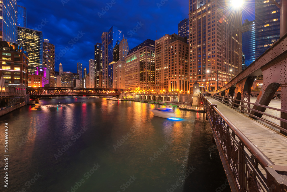 Night view of Chicago city and bridges cross river in Chicago, Illinois