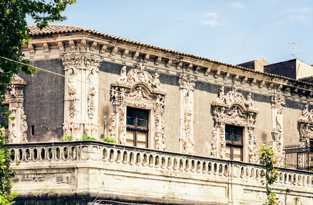 Balcony of old baroque building in Catania, traditional architecture of Sicily, Italy.