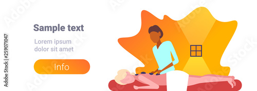 young girl enjoying traditional hot stone massage african american masseuse massaging patient woman hotel health spa concept horizontal banner portrait copy space