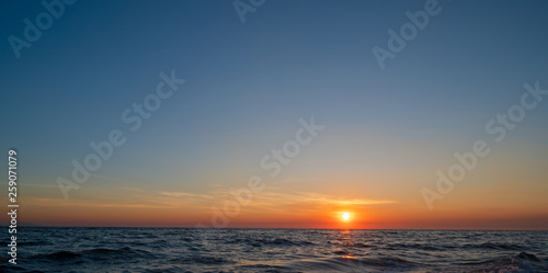 Sunset sky on the beach background.