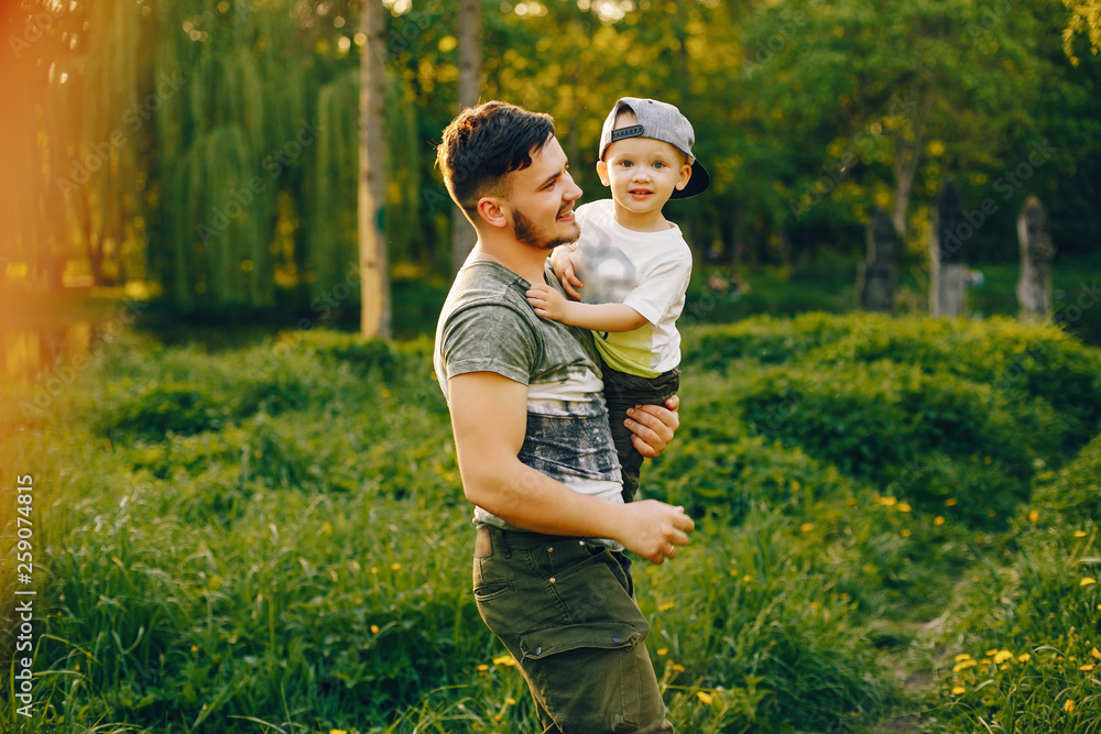 Fototapeta premium Father with son in a park