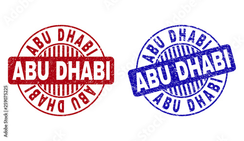 Grunge ABU DHABI round stamp seals isolated on a white background. Round seals with grunge texture in red and blue colors. Vector rubber imitation of ABU DHABI tag inside circle form with stripes.