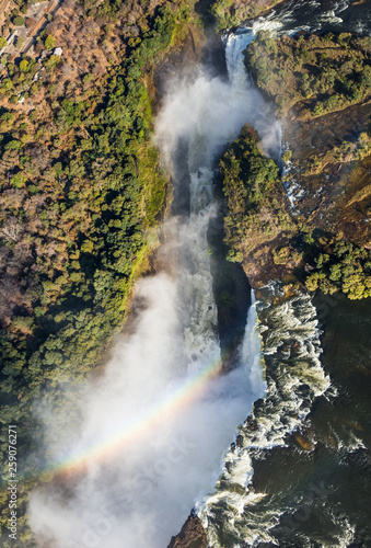 The Victoria falls is the largest curtain of water in the world. The falls and the surrounding area is the Mosi-oa-Tunya National Parks and World Heritage Site  helicopter view  - Zambia  Zimbabwe. Af