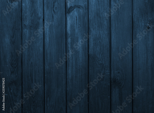 Old dark blue wooden wall, detailed background photo texture.