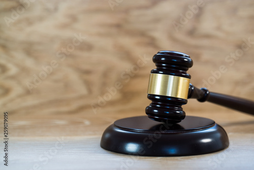 Law and justice concept image. Brown wooden background