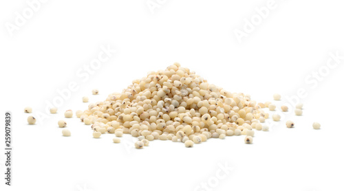 Pile of sorghum rice isolated on white background photo