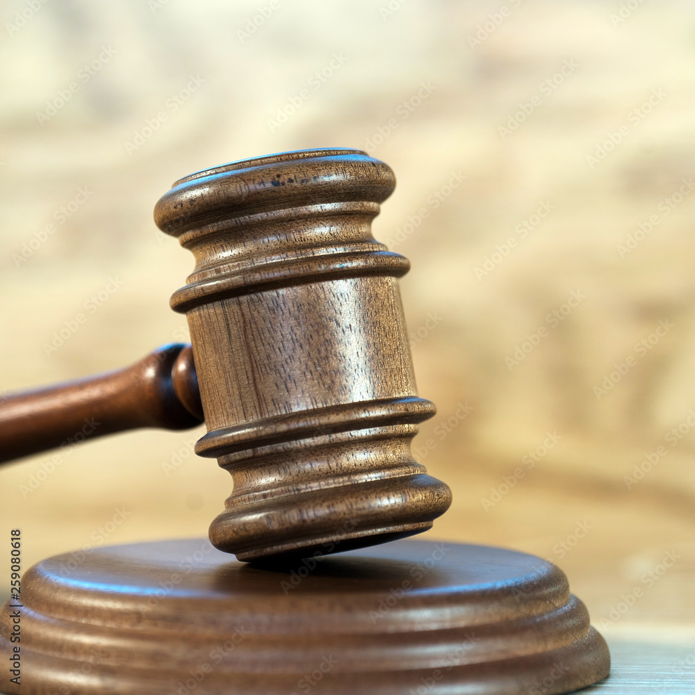 Law and justice concept image. Brown wooden background Law and justice concept image. Brown wooden background