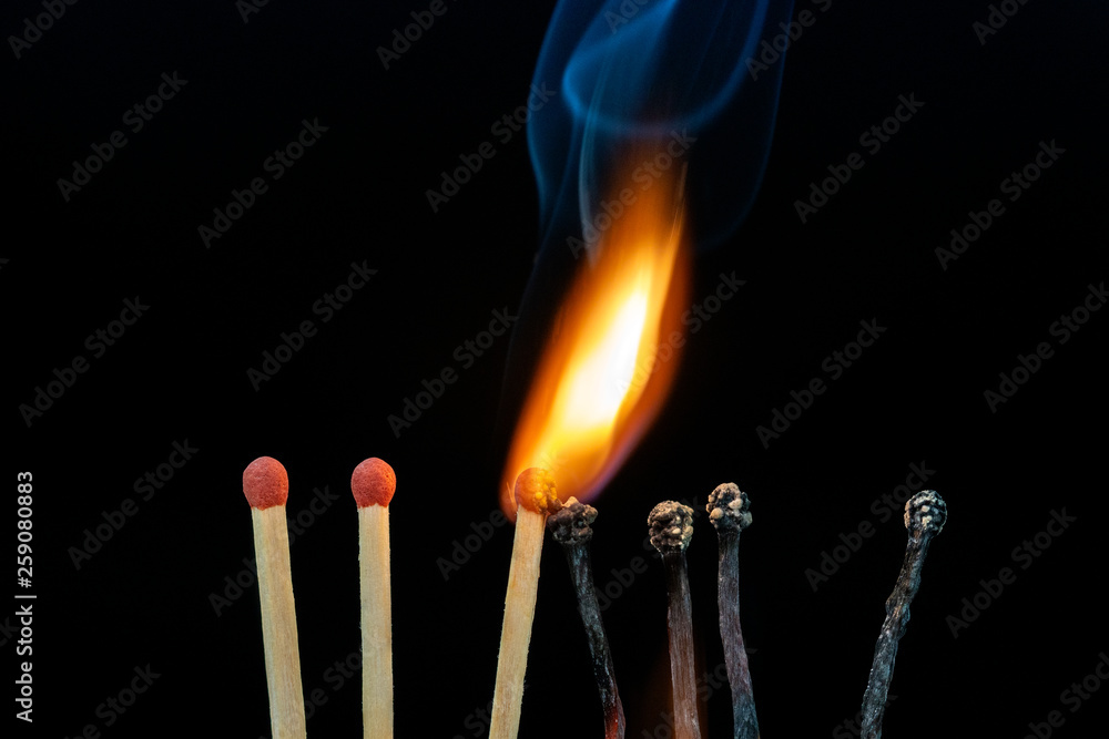 Burning matches on dark background Burning matches on dark background