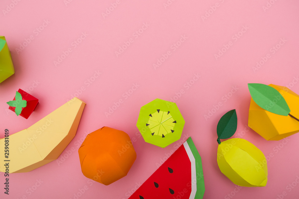 exotic fruits made of paper on pink background