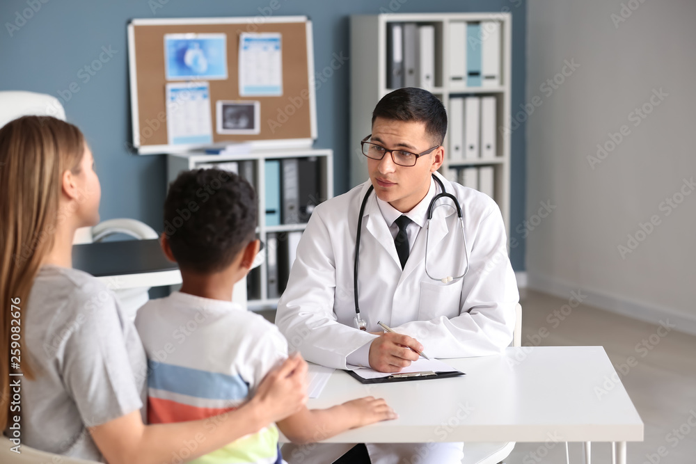 African-American boy with mother at pediatrician's office African-American boy with mother at pediatrician's office