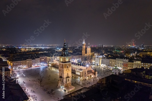 Aerial drone view Cracow old town and city main square at night.