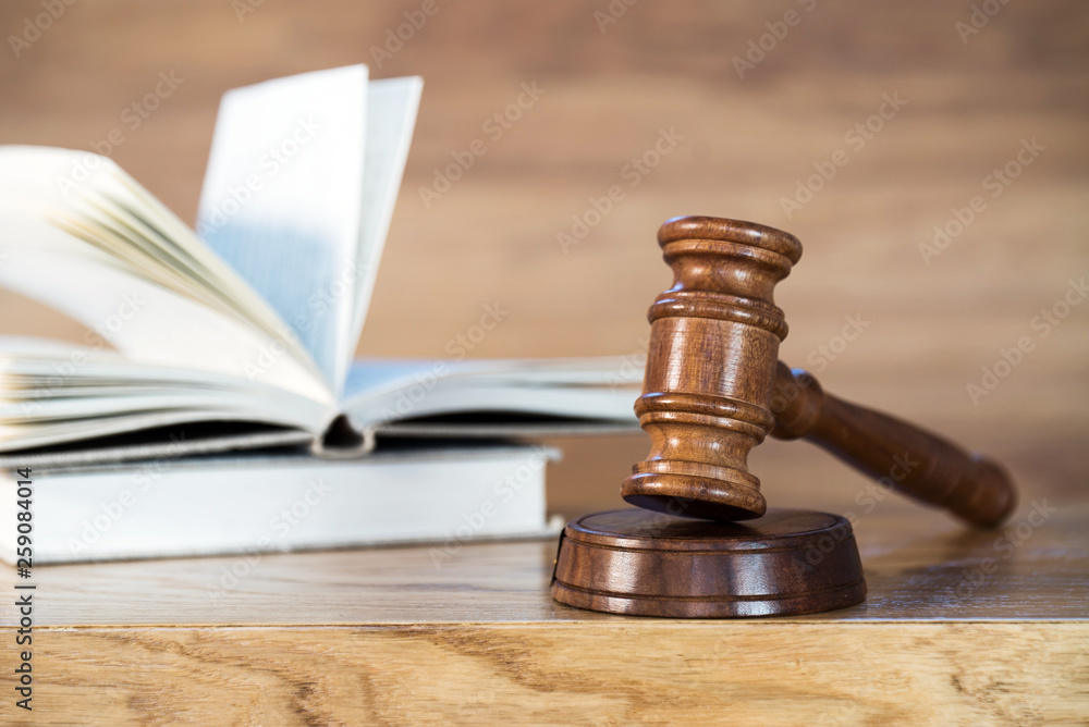 Law and justice concept image. Brown wooden background