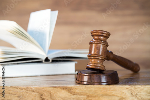 Law and justice concept image. Brown wooden background