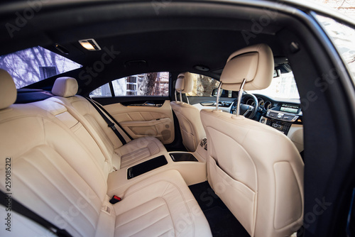 Inside the car with white leather seats
