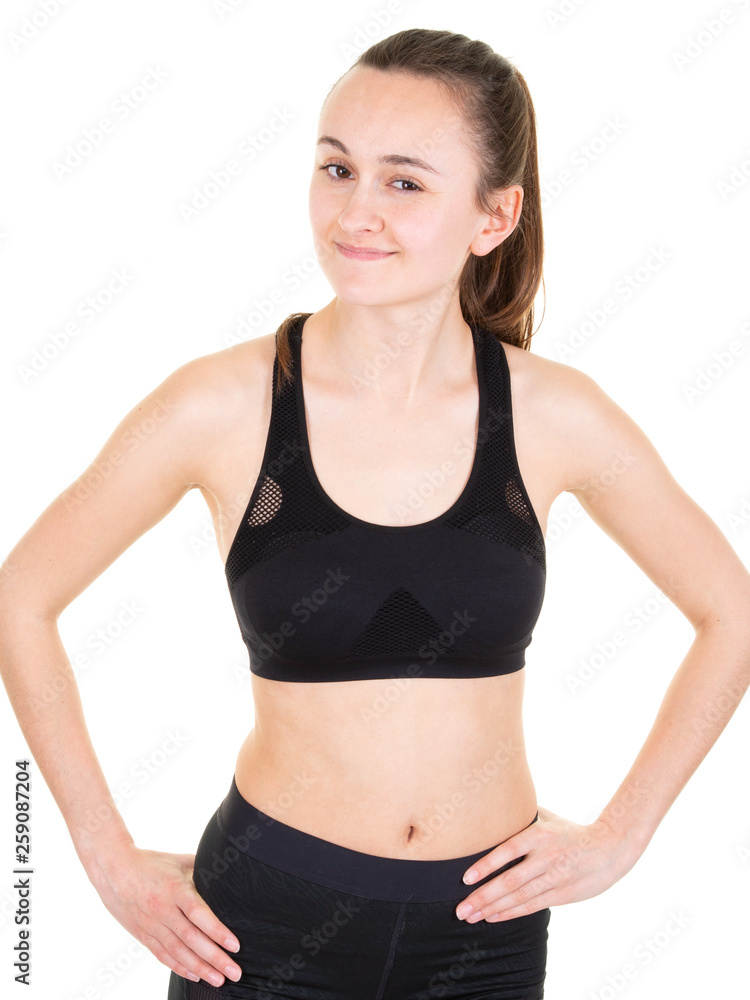 Fit girl in black sporty clothes on white background Fit girl in black sporty clothes on white background