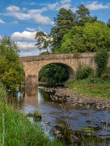 Stone bridge over the River Derwent in Blanchland, Northumberland, England, UK
