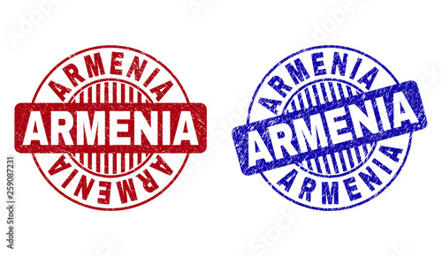 Grunge ARMENIA round stamp seals isolated on a white background. Round seals with distress texture in red and blue colors. Vector rubber imprint of ARMENIA caption inside circle form with stripes.