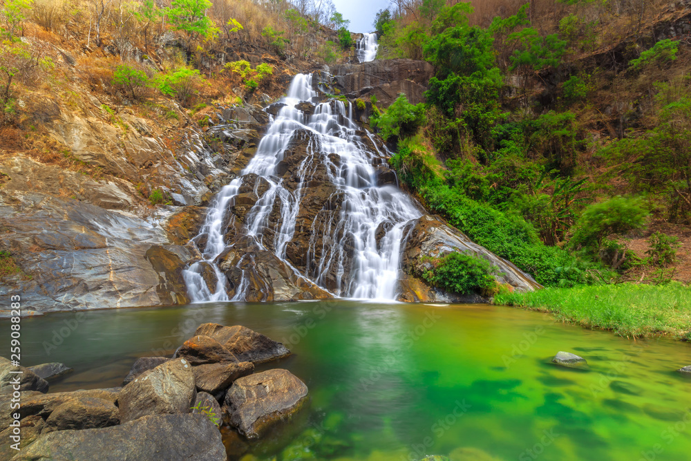 Tao Dam waterfall, the beautiful waterfall in deep forest at Klong Wang  Chao national park ,Kamphaeng Phet, Thailand Stock Photo | Adobe Stock