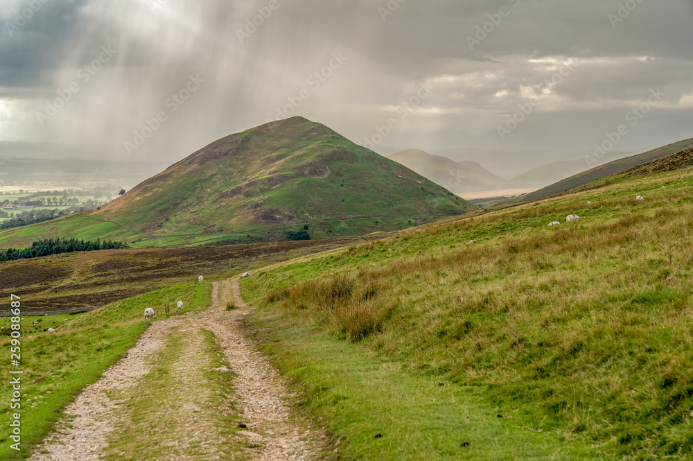 North Pennines landscape, looking at the rain clouds over Dufton Pike in Cumbria, England, UK