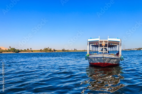 Tourist boat sailing on the Nile river in Luxor, Egypt