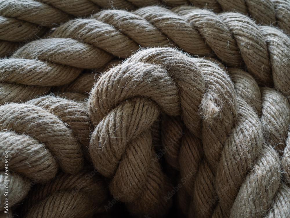 The thick rope twisted in a roll. A long rope for wide use
