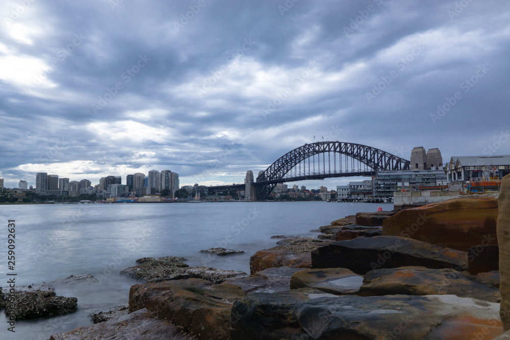 Naklejka premium sydney harbour bridge at evening
